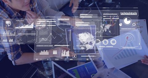 Business team analyzing data with digital financial graphics