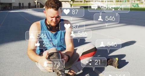 Disabled Athlete Adjusting Prosthetic Leg on Outdoor Track