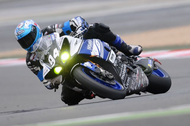 Motorcycle Racer Leaning Lower in Curve during High-Speed Track Race - Download Free Stock Photos Pikwizard.com