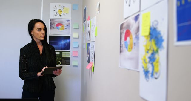 Businesswoman Analyzing Data Charts in Office Meeting Room - Download Free Stock Images Pikwizard.com