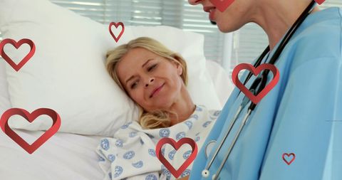 Hospital Patient Smiling at Caring Nurse with Stethoscope
