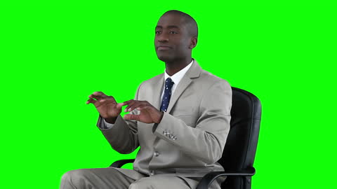 Man Typing on Invisible Keyboard Against Green Screen