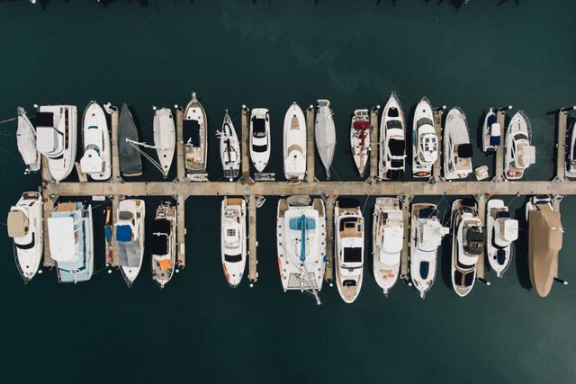 Aerial View of Boats Docked in Marina in Serene Waters - Download Free Stock Images Pikwizard.com
