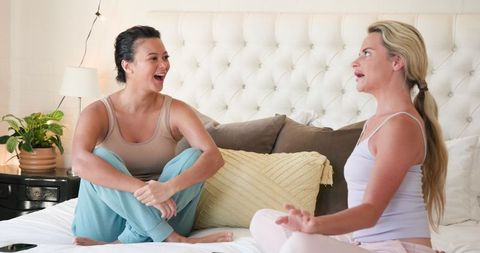 Diverse Female Friends Enjoy Relaxing Chat at Home