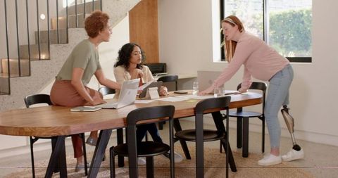 Diverse Female Team Collaborating in Modern Office Workspace