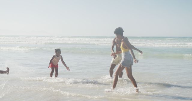 Happy Family Playing at Beach on Sunny Day - Download Free Stock Images Pikwizard.com