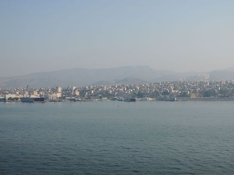 Scenic Coastal City View With Distant Mountains