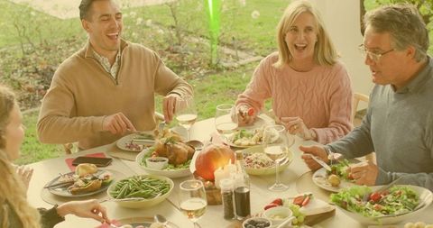 Sunlit Family Gathering on Porch Sharing Roast Chicken, Fall Dinner with Wine and Pumpkin