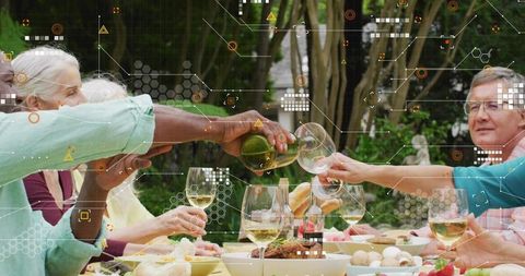 Multigenerational group toasting with wine at garden dinner with HUD overlay