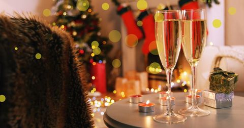 Cozy Christmas Ambiance with Champagne Glasses and Gifts