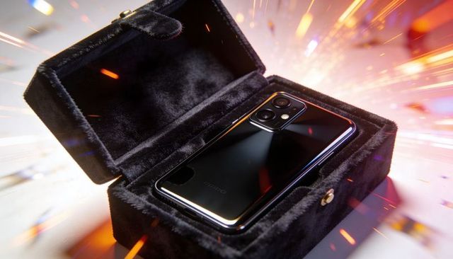 Glossy smartphone resting in black velvet jewelry box with dramatic sparks and studio glow