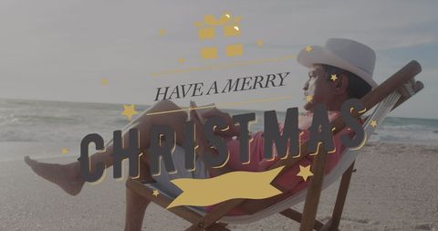 Senior Man Relaxing with Book on Tropical Beach at Christmas