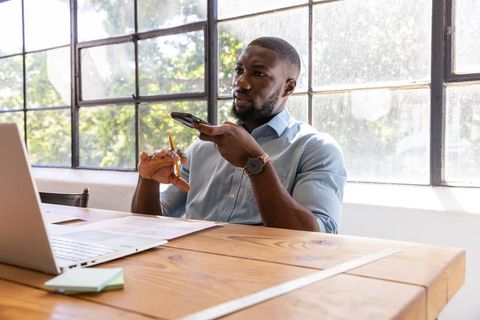 Businessman engaging in phone communication in contemporary office