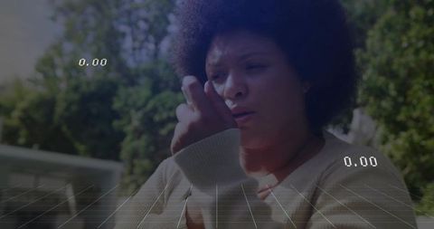 Woman Examining Hand in Modern Nature-Inspired Setting