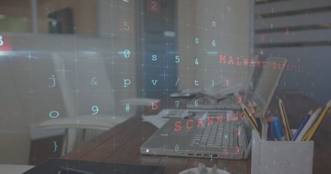 Cybersecurity concept with computer code overlay on office desk