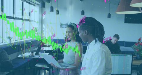 Coworkers analyzing financial graphs for business planning
