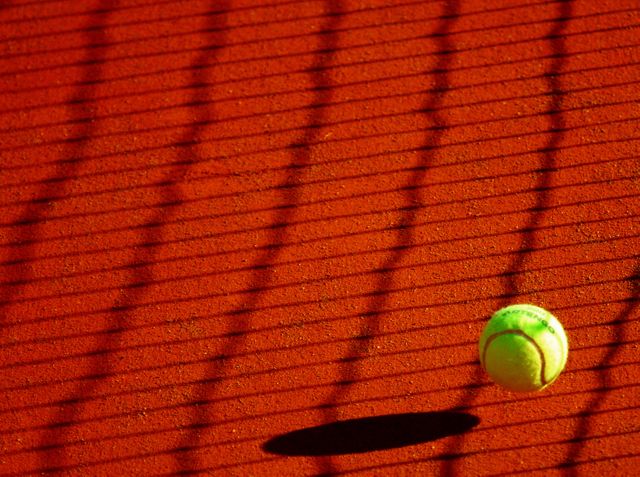 Green Tennis Ball on Red Floor during Sunny Day - Download Free Stock Photos Pikwizard.com