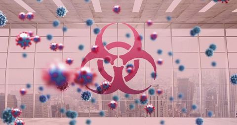 Biohazard symbol and virus cells overlooking cityscape