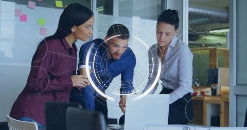 Diverse team collaborating on data analysis project in modern office