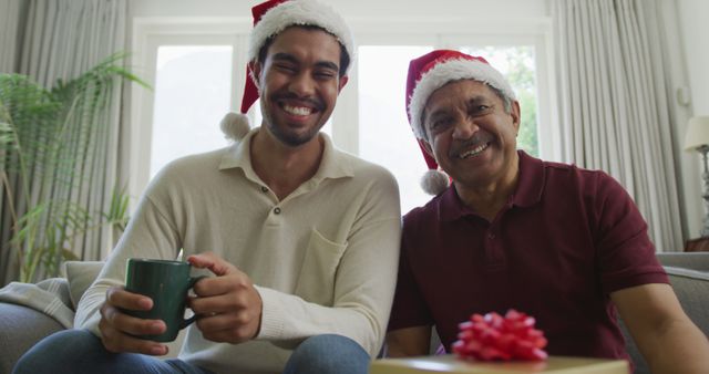 Father and Son Celebrating Christmas at Home, Relaxing with Gift and Coffee - Download Free Stock Images Pikwizard.com