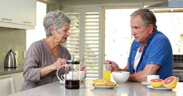 Senior Couple Enjoying Breakfast Together at Home Kitchen - Download Free Stock Images Pikwizard.com