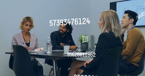 Diverse Business Team Engaged in Data Processing Meeting