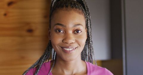 Smiling Woman in Cozy Log Cabin Interior
