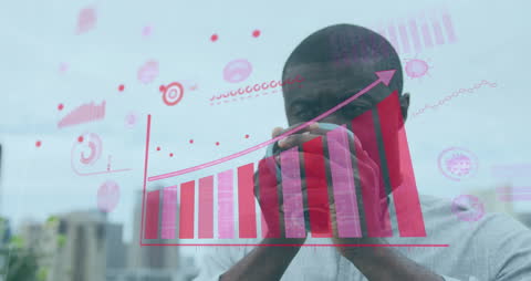 Businessman Analyzing Virtual Financial Data Graphics