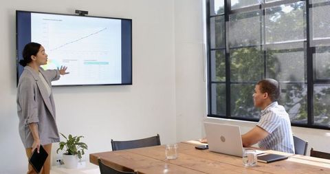 Professional Presentation in Modern Office Meeting Room