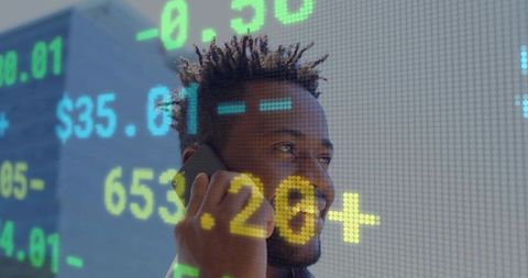 Businessman Talking on Phone with Stock Market Ticker Overlay