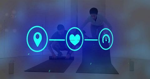 Fitness Partners Rolling Yoga Mats in Studio Projecting Cyan Holographic Health Icons
