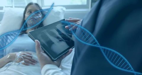 Doctor reviewing chest x-ray on tablet at bedside with dna helix overlay