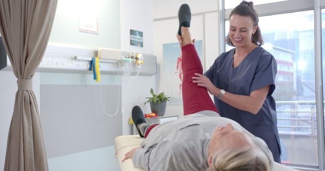 Caregiver Assisting Elderly Woman with Physical Therapy in Clinic - Download Free Stock Images Pikwizard.com