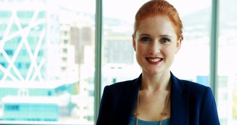 Cheerful Female Executive in Modern Office Space