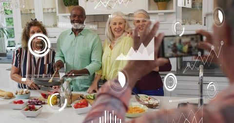Multigenerational group posing and cooking with smartphone AR overlays in modern kitchen