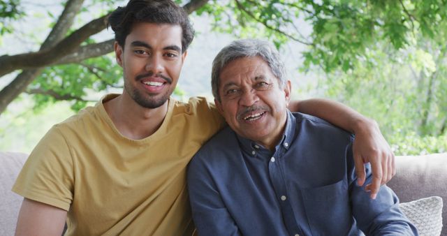 Smiling Grandfather and Grandson Embracing Outdoors - Download Free Stock Images Pikwizard.com