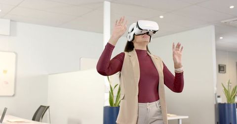 Businesswoman innovating with vr in modern workspace