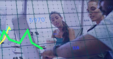 Business Meeting Analyzing Financial Data and Charts