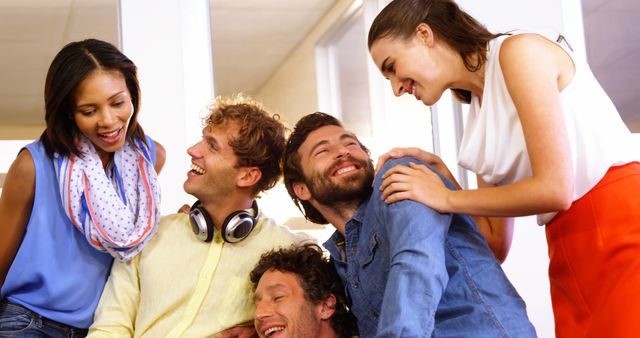 Young Professionals Laughing and Bonding at Work - Download Free Stock Images Pikwizard.com