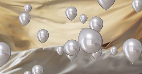 Floating Silver Balloons on Gold Backdrop for Celebrations - Download Free Stock Images Pikwizard.com