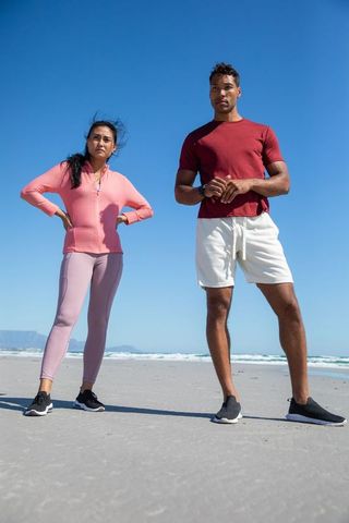 Active Diverse Couple Enjoying Beach Fitness Adventure