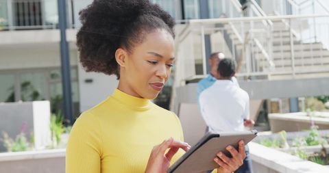 Focused Businesswoman Interacting with Tablet Outside Office - Download Free Stock Images Pikwizard.com