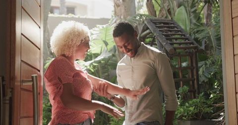 Romantic Garden Proposal with Joyful Couple Embracing Change