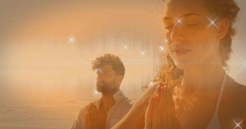 Couple Meditating at Sunset Beach with Sparkling Effects for Tranquility and Zen Vibes
