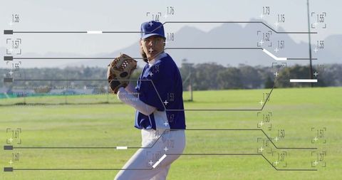 Female baseball player pitching during outdoor practice