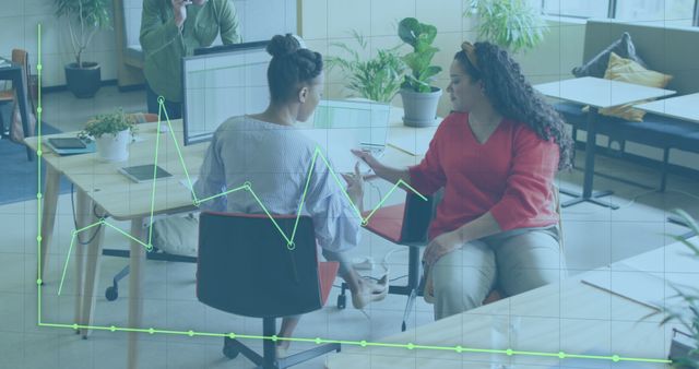 Two Women Analyzing Financial Chart in Office Environment - Download Free Stock Images Pikwizard.com