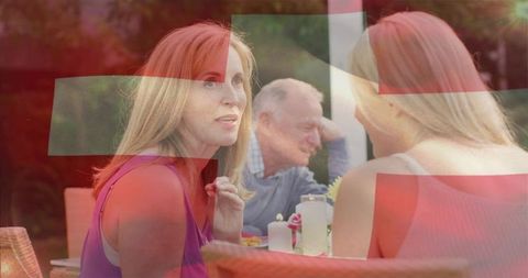 Family gathering on garden patio with warm atmosphere