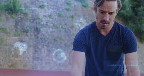 Man interacting with holographic data outdoors