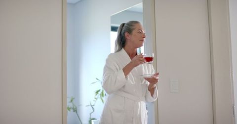 Mature Woman Enjoying Morning Tea in Cozy Home