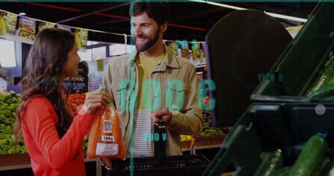 Happy Couple Shopping for Fresh Carrots at Grocery Store